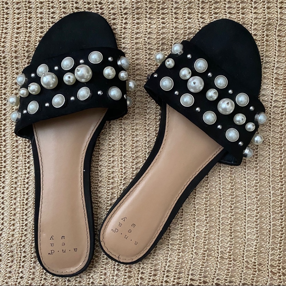 black sandals with pearl detailing